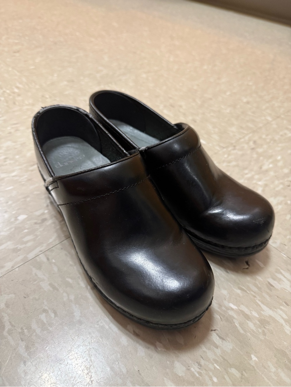 Dansko Black Leather Slip-On Clogs